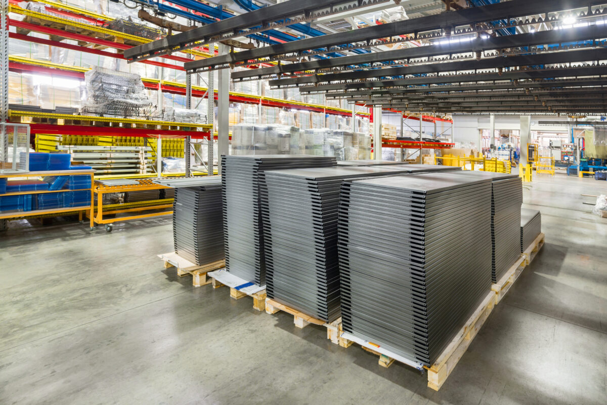 Metal Shelves For Storage Racks. Products Of The Plant For The Production Of Metal Profiles, Products Stacked.